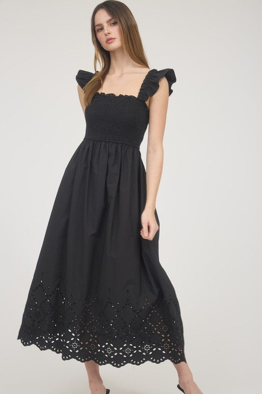 black eyelet midi dress Odelia Strapless in Stitch And Feather Whether styled with sneakers for a casual outing or boots for a dressier vibe Black Smocked Midi Dress with