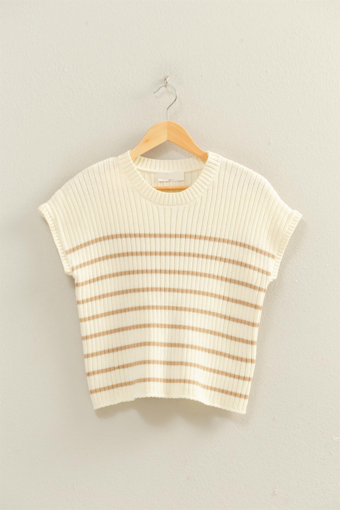 Striped sleeveless top on a hanger against a plain background