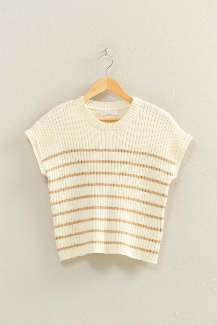 Striped sleeveless top on a hanger against a plain background